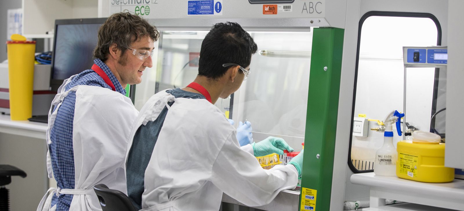 Andreas Kupz and colleague, in lab coats