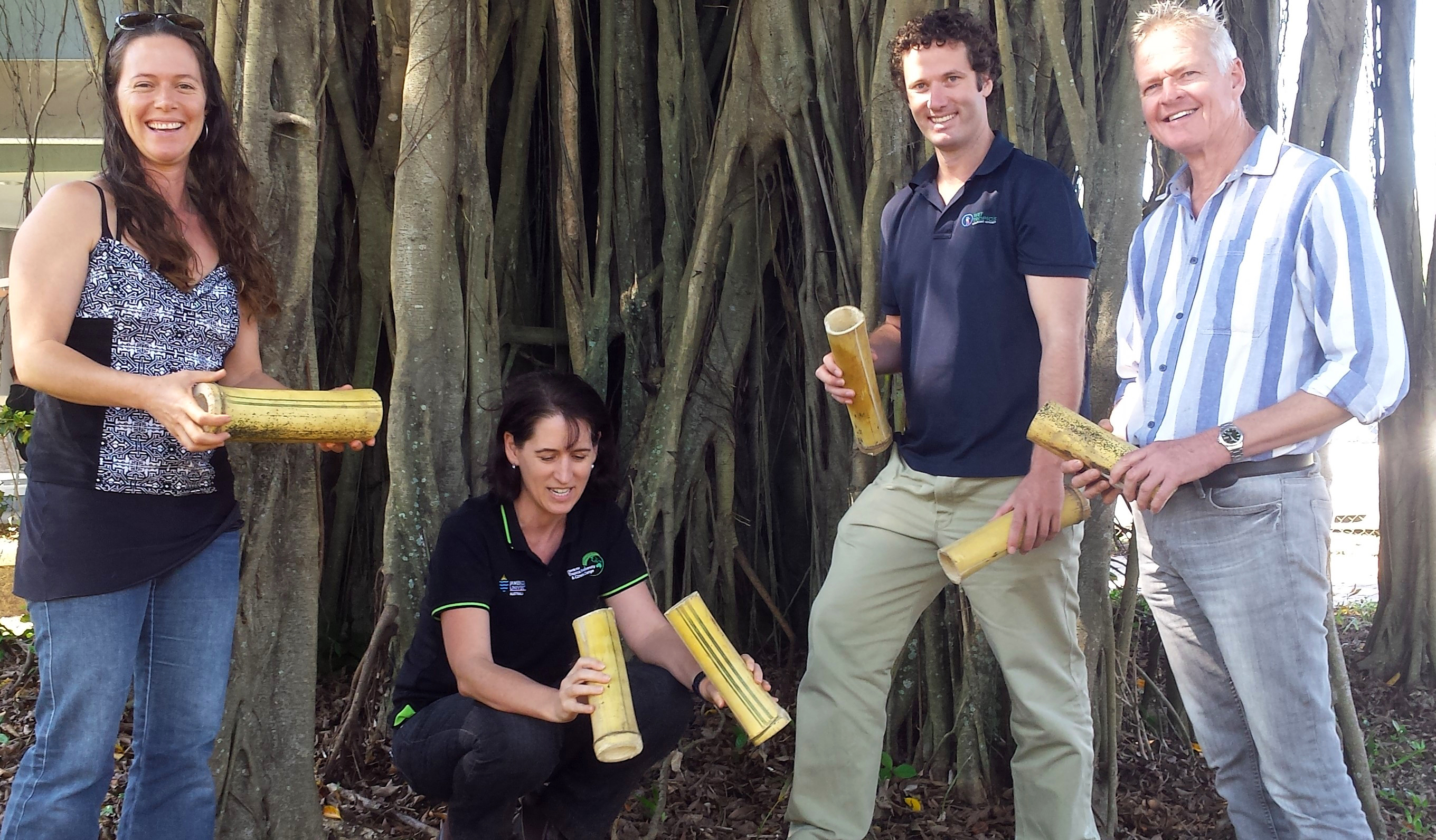Kuranda Envirocare Coordinator Sylvia Conway, JCU researcher Dr Lori Lach, Chris Clerc from the Wet Tropics Management Authority and Neil Boland, Kuranda Envirocare, with bamboo segments that are being used to lure yellow crazy ants. 