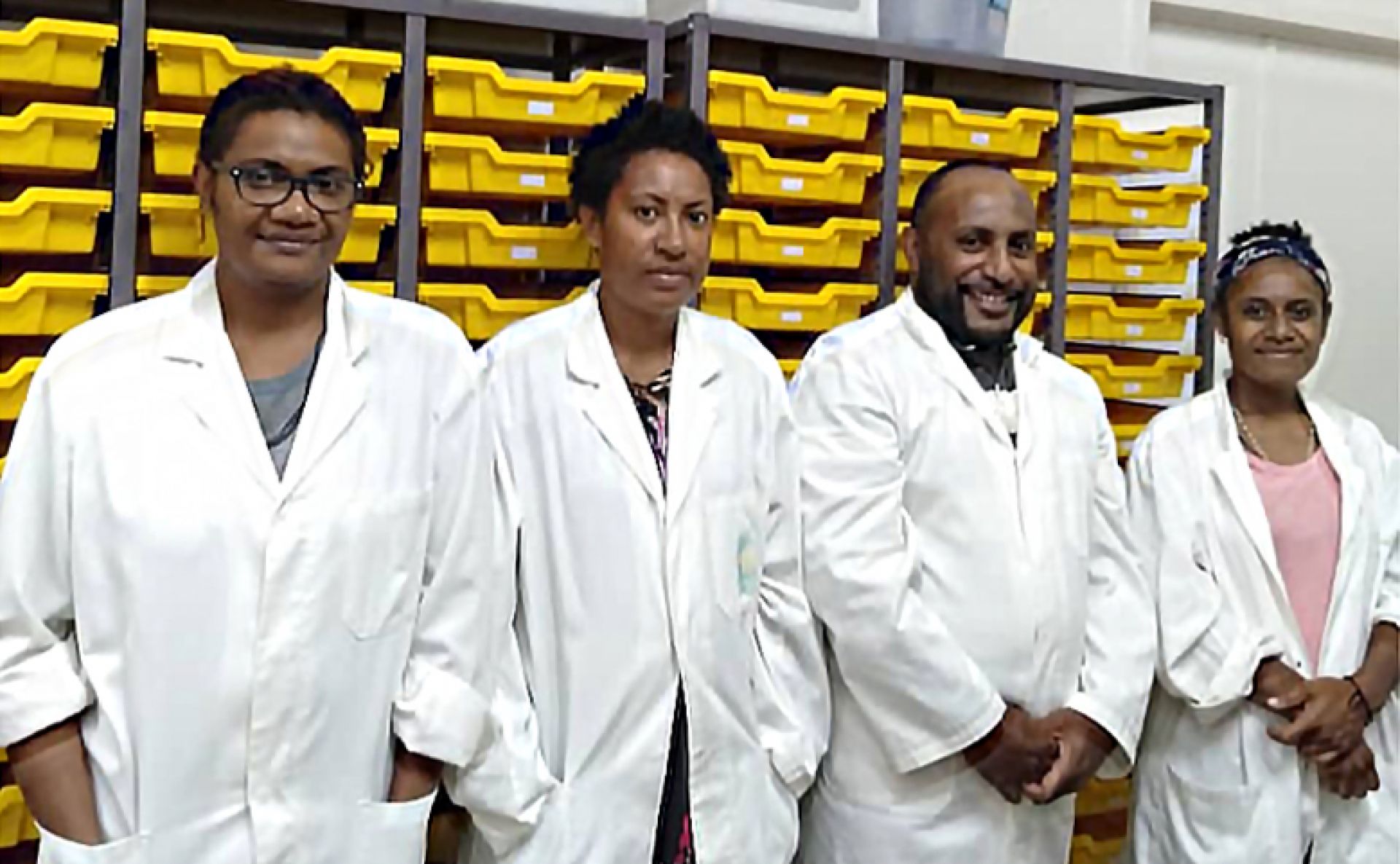 Researchers in lab coats
