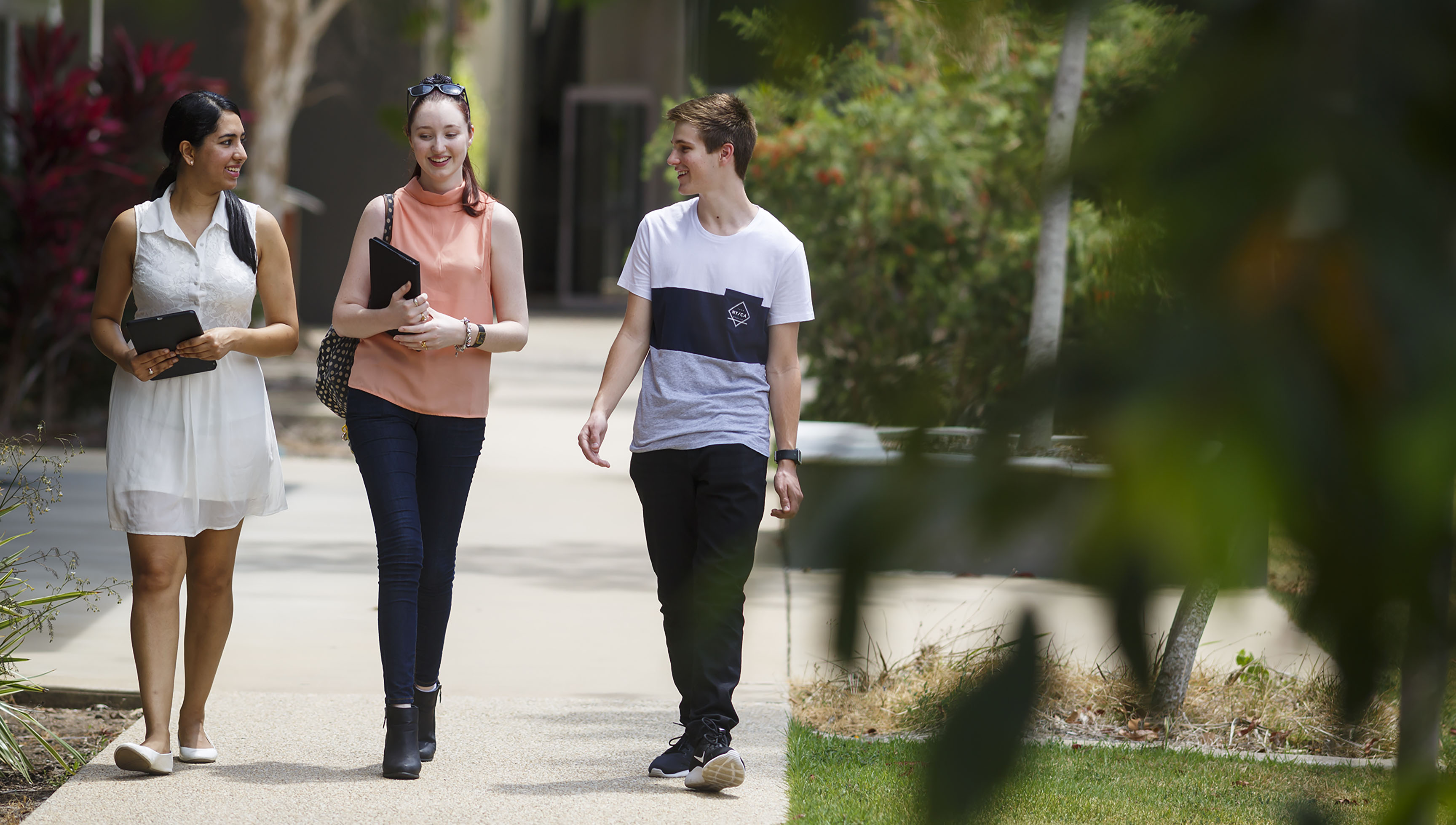 three students on campus