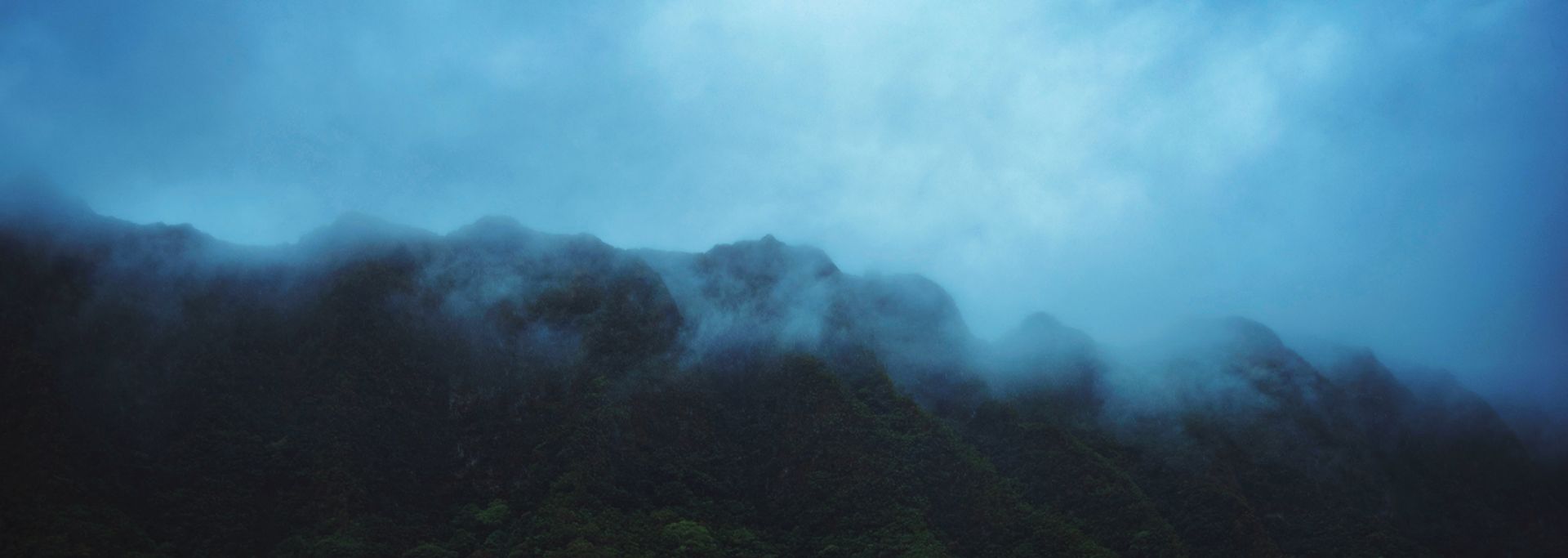 dark clouds and mountain range