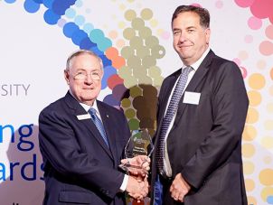 Dr Jeffrey Ayton receiving his award from former Chancellor Lieutenant General John Cedric Grey AC 