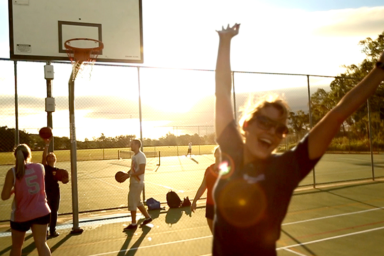 Students playing basketball. 