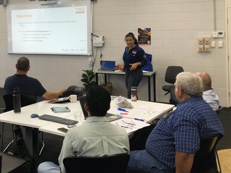 Ana presenting at a conference. 