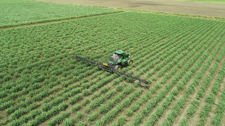 Image of field with tractor from above.