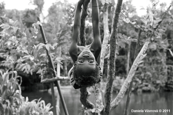Child hanging from a tree.
