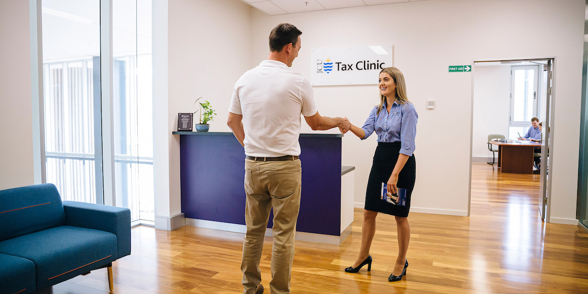 Tax adviser pointing to computer screen