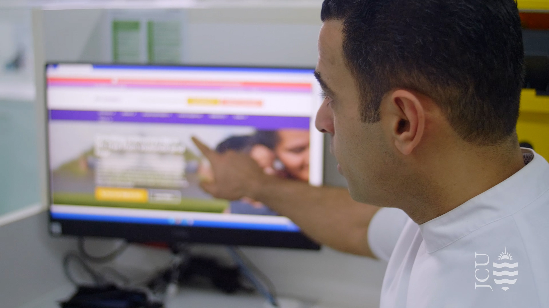 dentist pointing at computer screen. 