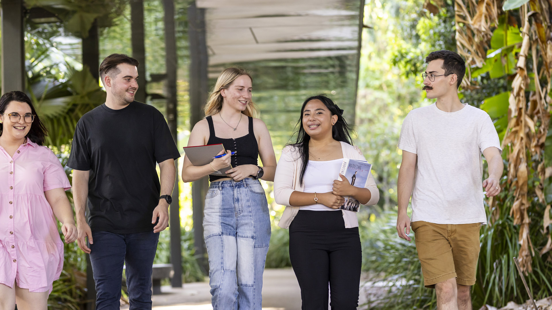 JCU Bachelor of Medicine, Bachelor of Surgery international student on campus with fellow JCU students. 