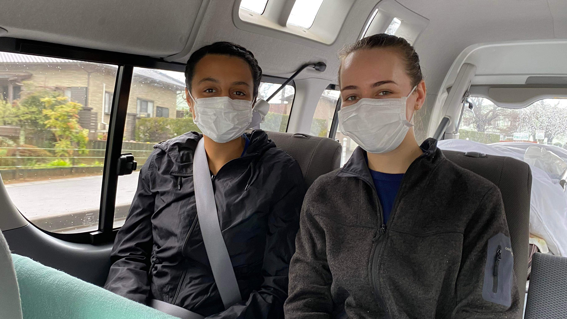 JCU Bachelor of Medicine, Bachelor of Surgery student sits with another student while completing her overseas placement. 