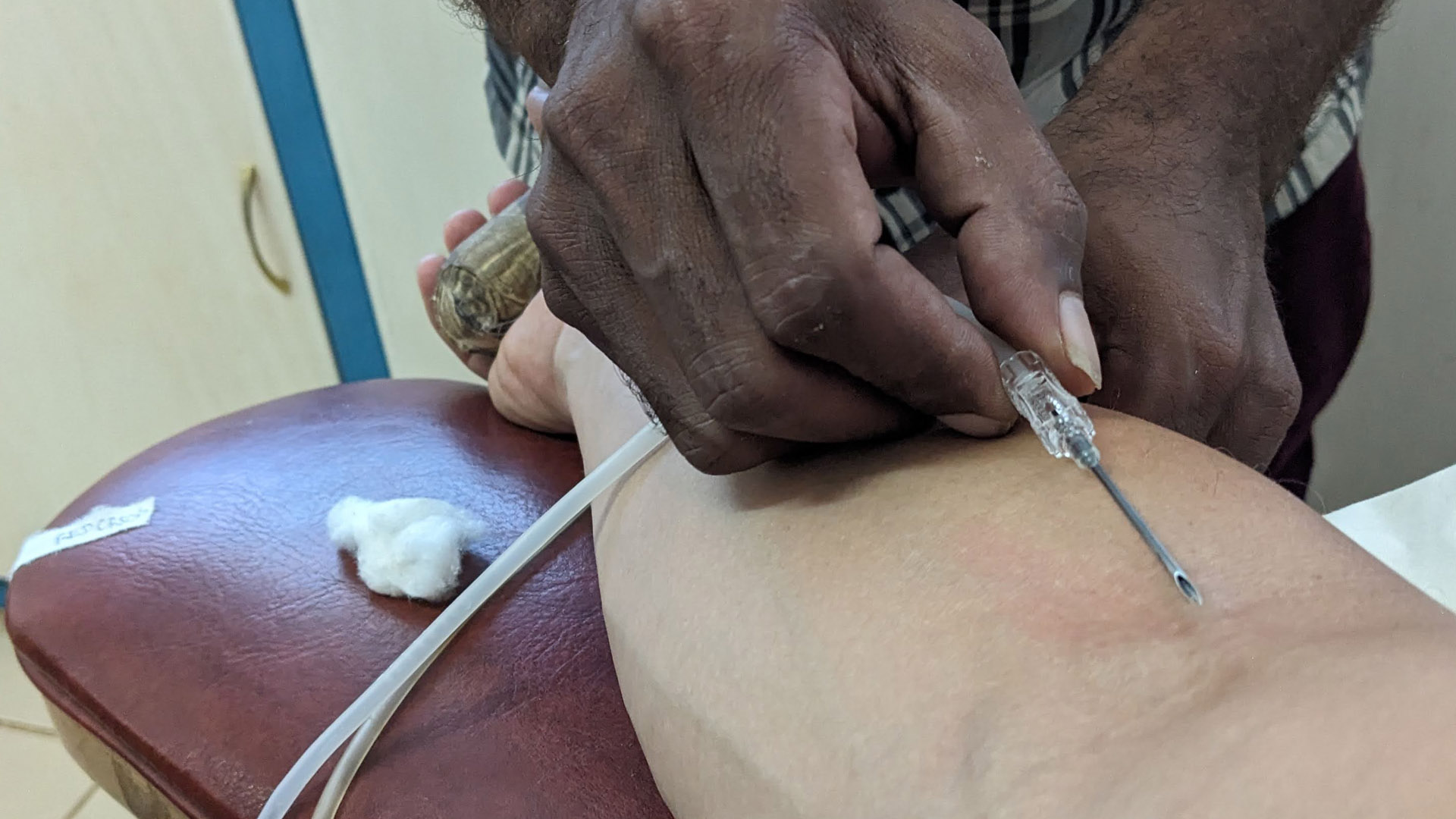 A medical practitioner in the Solomon Islands gives an injection. 
