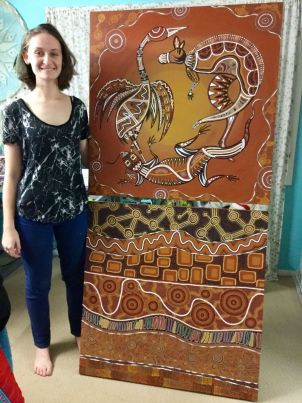 Mindy with one of her paintings
