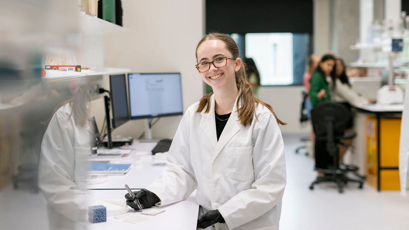 Student in science laboratory. 