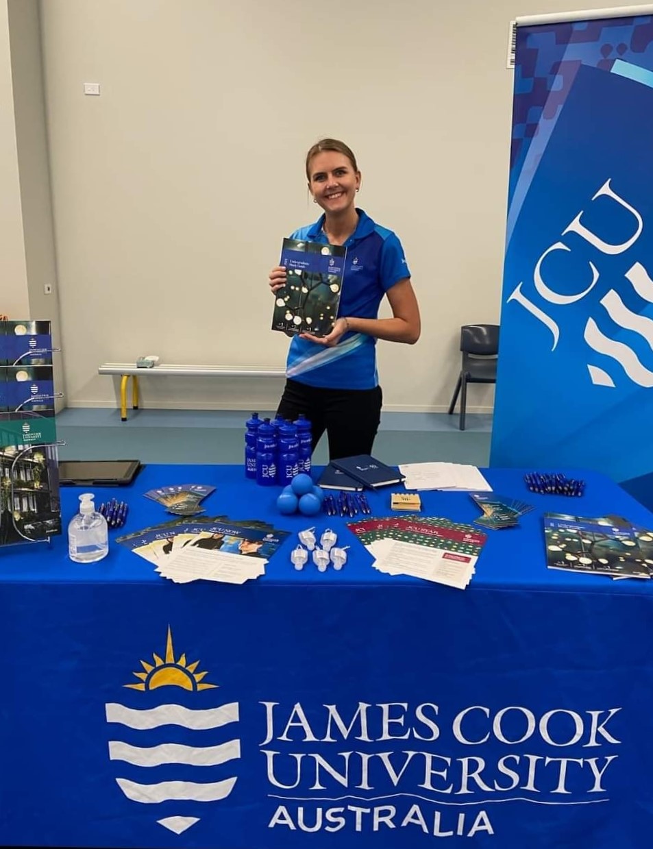 Laura working at a JCU stall