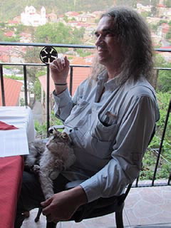 Alan is adopted by a restaurant cat in Pedoulas, Cyprus.