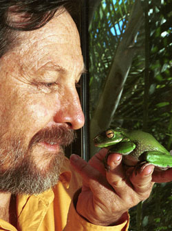 Prof Speare holding a frog up to his face
