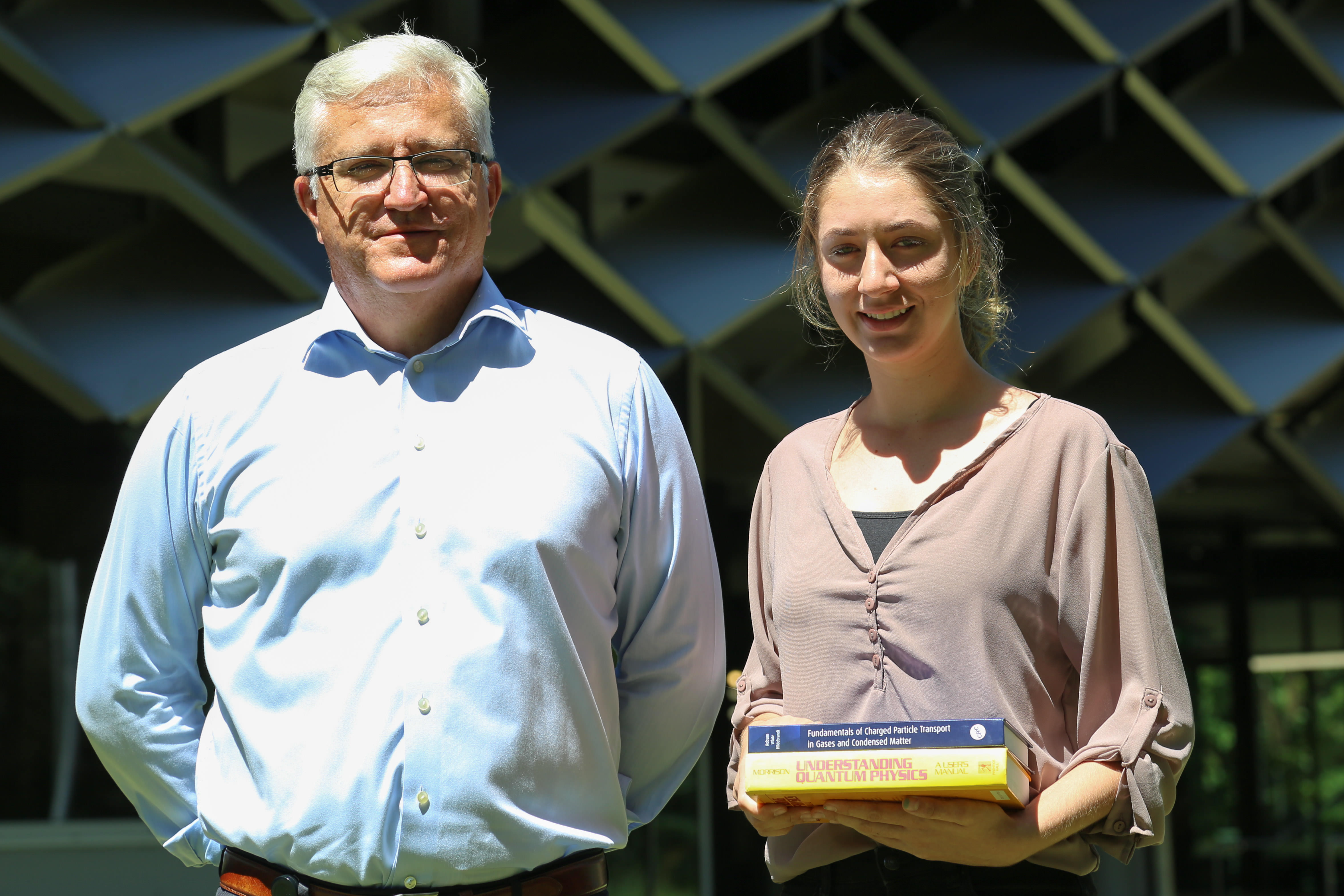 Prof Marcus Lane stands next to Mikala Wright outside The Science Place