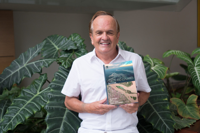Eric holds up his book