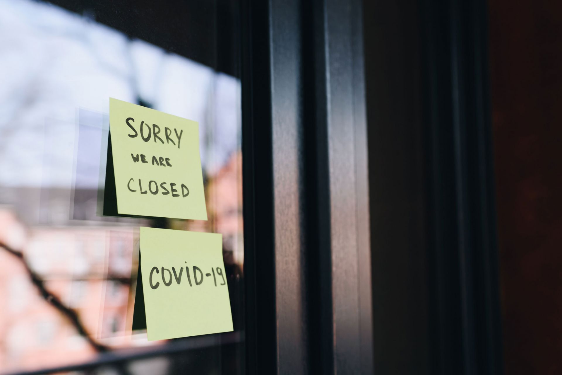 Stick notes on a window saying 