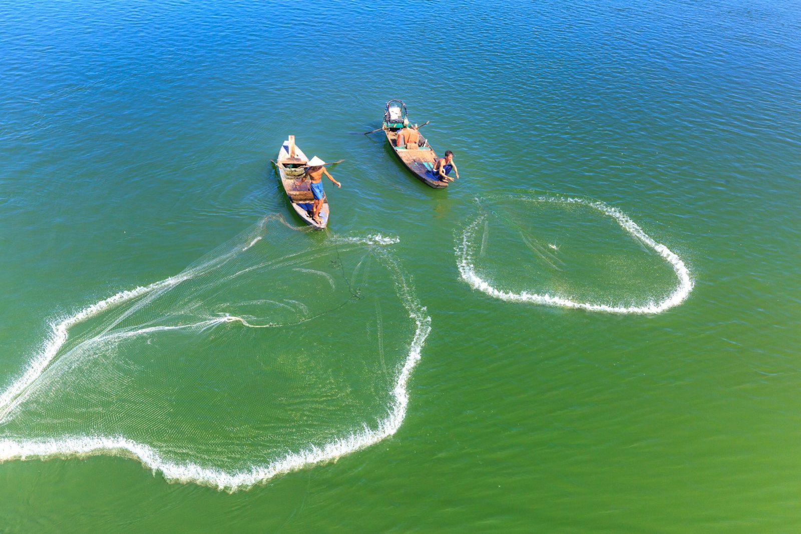 Fishermen fishing with nets