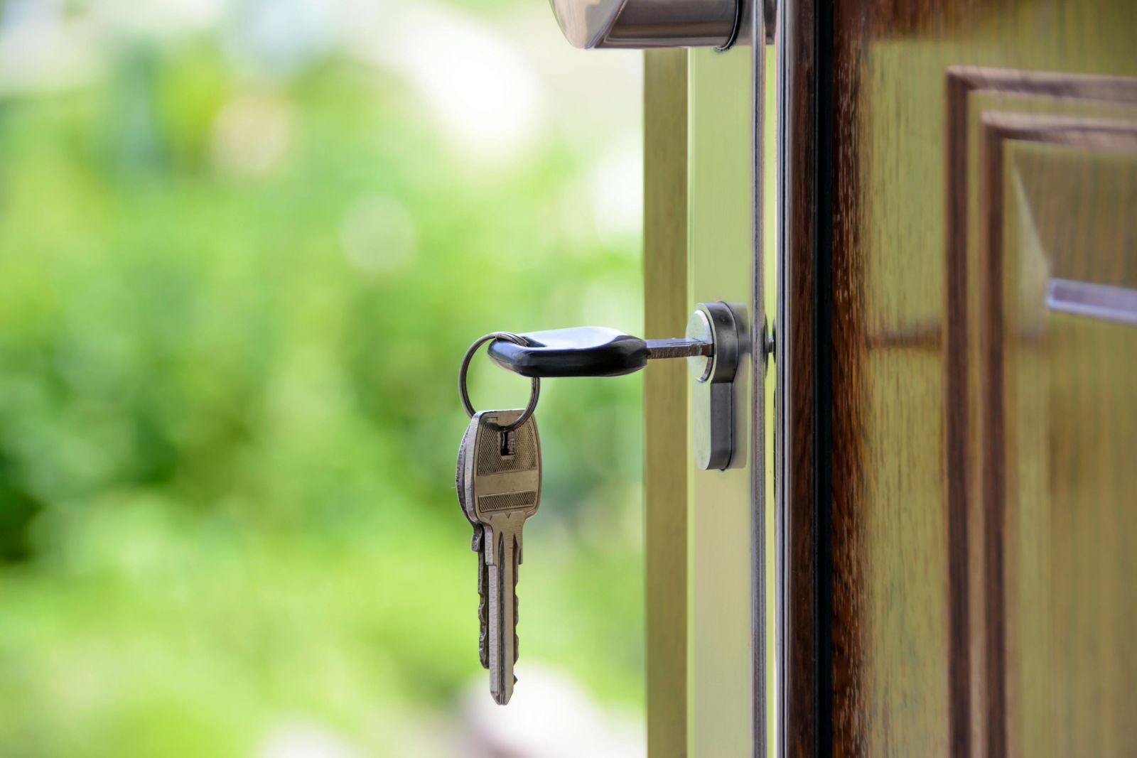 A photo of a key left in a house door.