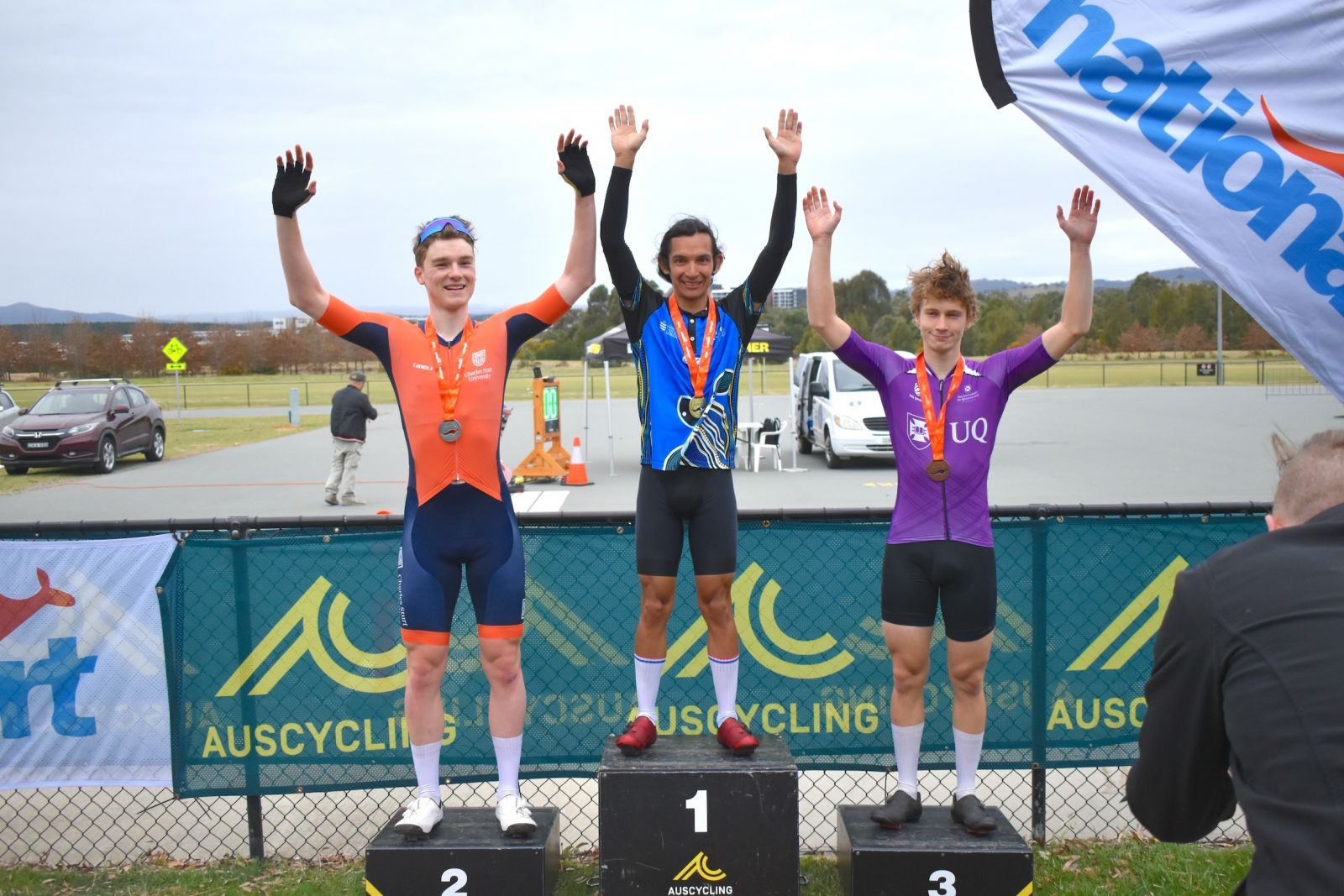 JCU student Thomas Beddome stands on the podium after winning the UniSport Nationals Men’s Cycling Time Trial.