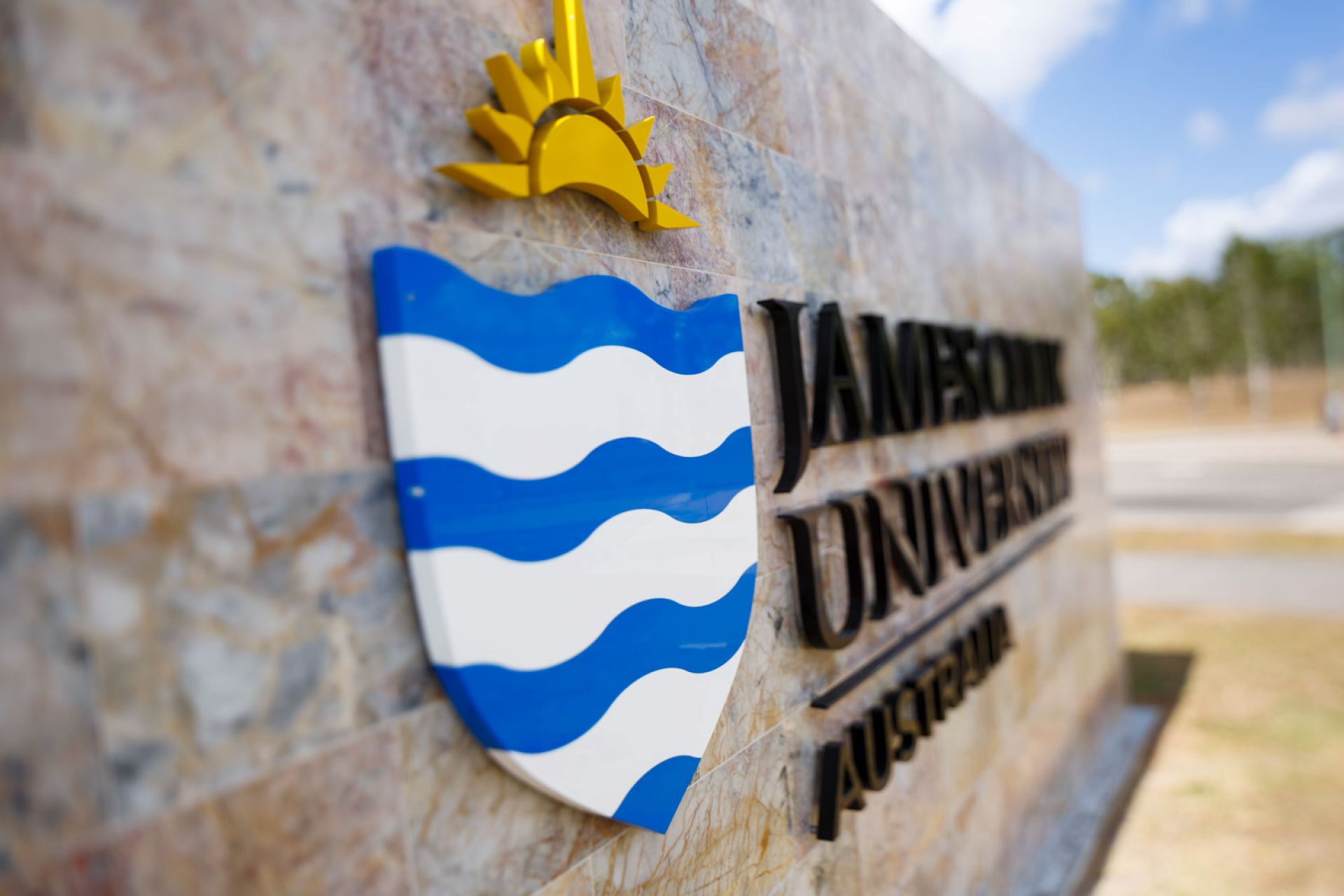 Artistic photo of the large sign at the campus entrance