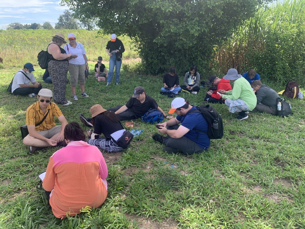 JCU students learning site survey and mapping at an archaeological site in Northeast Thailand