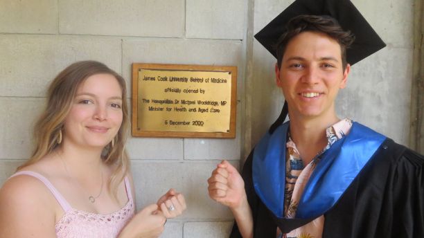 Toby with his sister near the Med school plaque