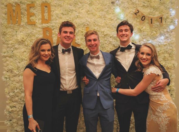 Group of five young people in formal wear