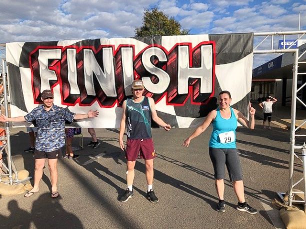 Three people at finish line