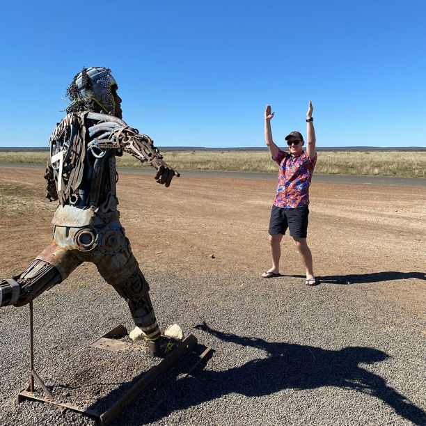 Footballer sculpture and tourist