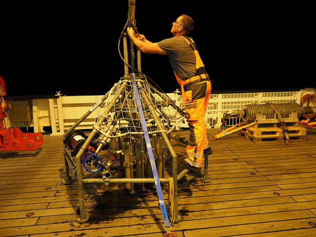 Crewmember prepares the underwater camera