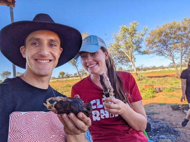 young man and woman eating kangaroo tail