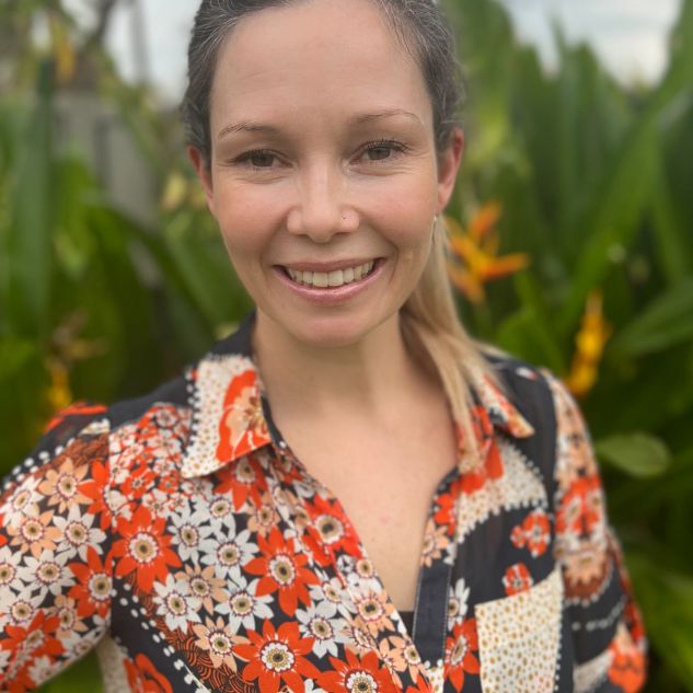 woman in colourful shirt in garden