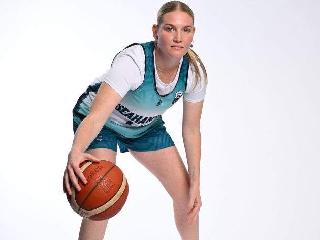 Majella Carey in her North Gold Coast Seahawkes uniform and a basketball.
