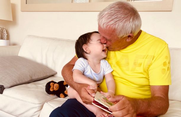 Florence's daughter and father reading together. 