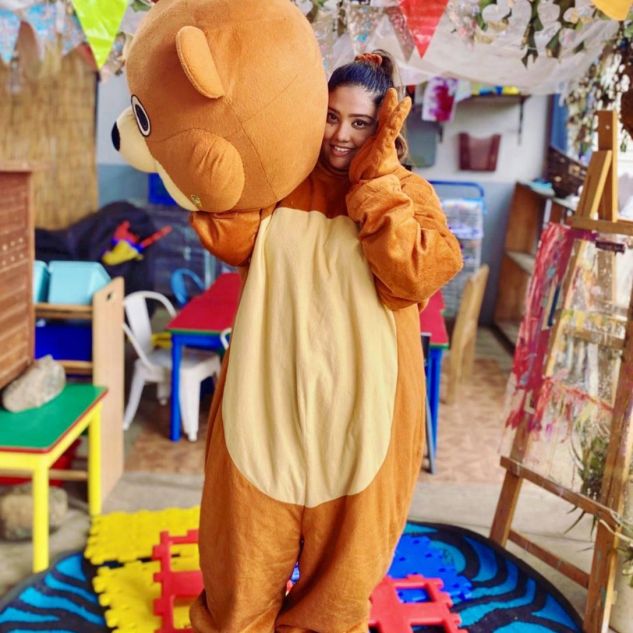 Young woman in teddy bear suit