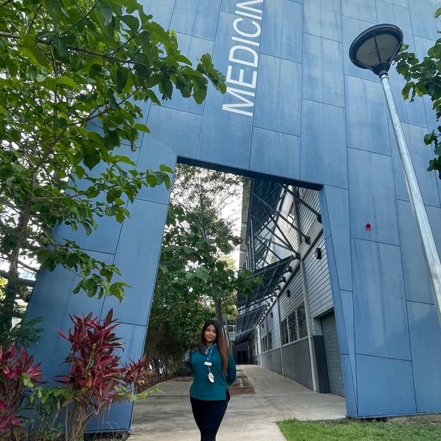 young woman in front of medicine sign