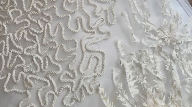 A close-up of the material on Robyn's dress artwork