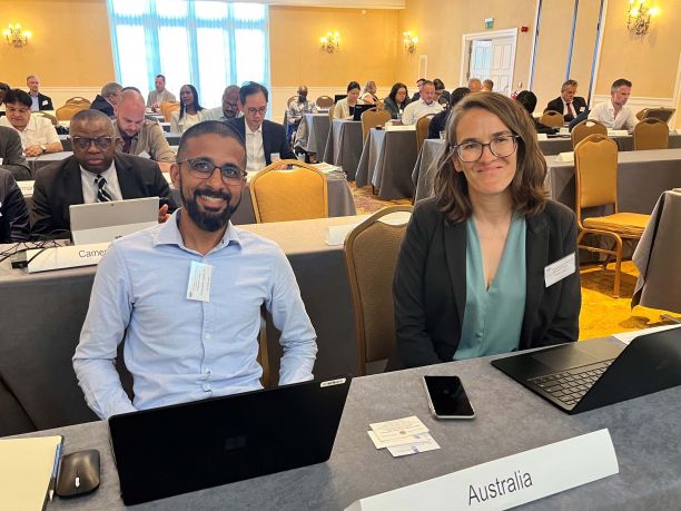 Tori Lamb and a colleague sit in the Civil Aviation Conference. 