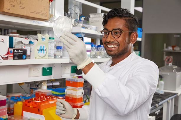 man with glasses in medical lab