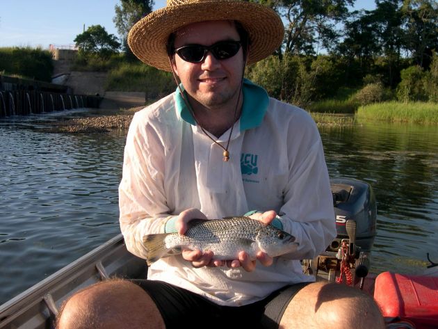 damien burrows holding a fish