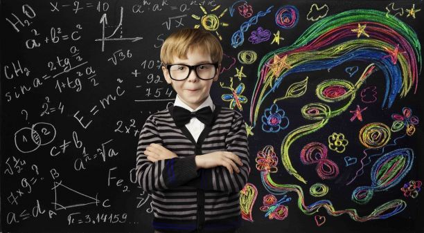 child standing in-front of chalk board